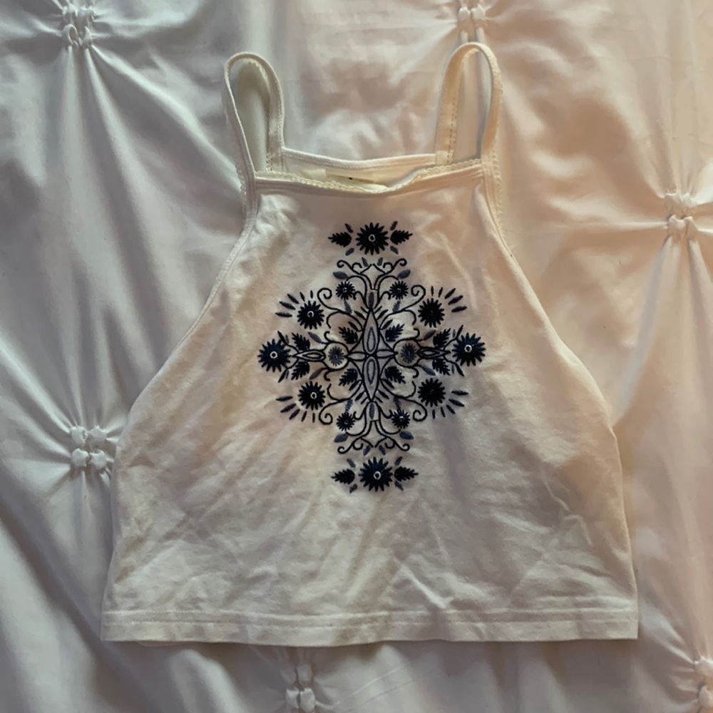 White tank top with navy blue stitching Size small